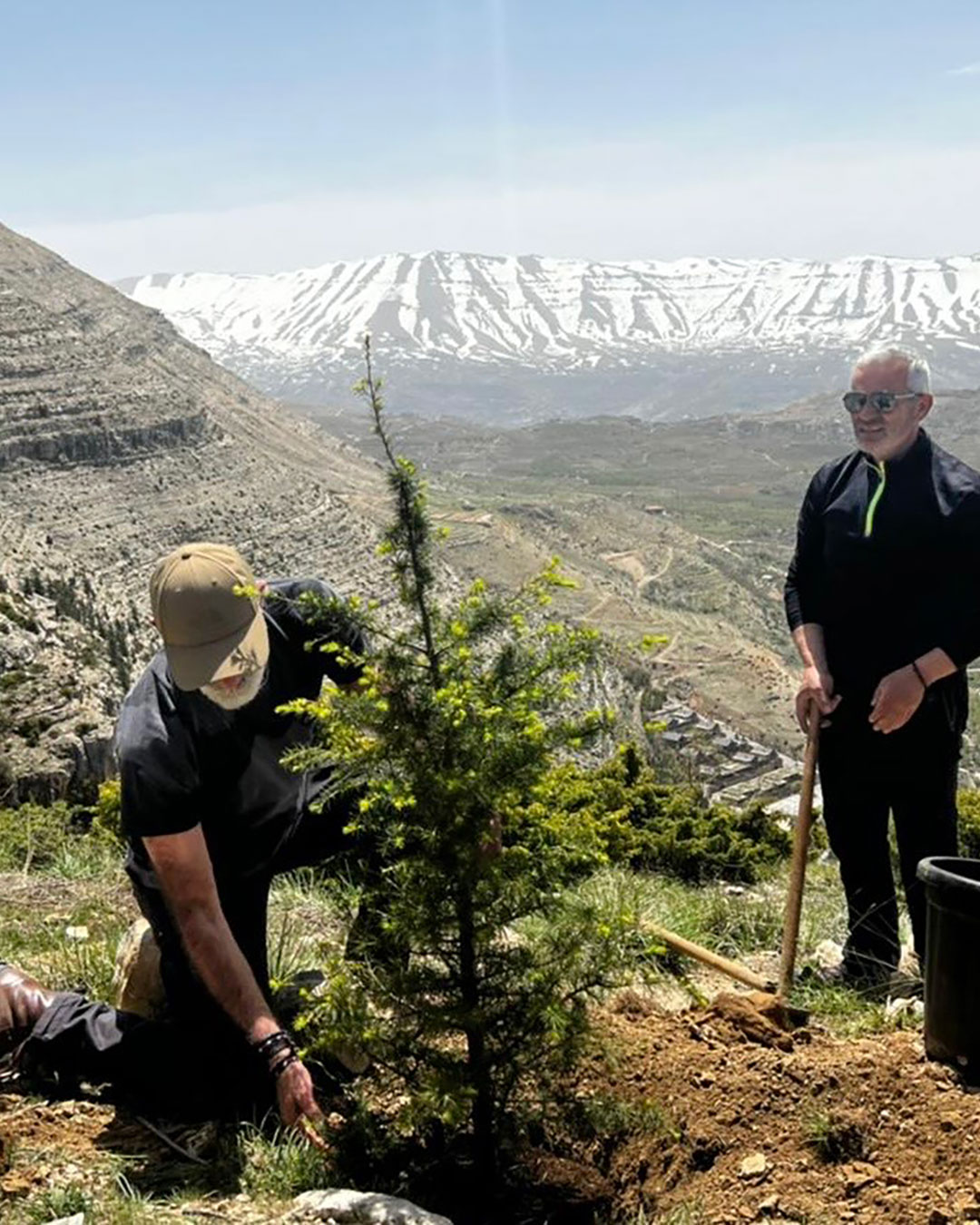 Sami planting a Cedar in Ehden